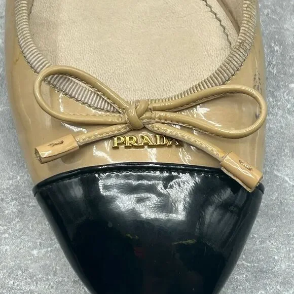 Prada Beige Black Leather Ballet Flats Slip On Size 39.5 Bow Accent Cap Toe